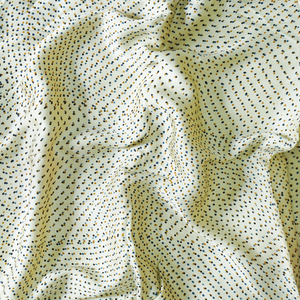 Modal Silk Cream With Black And Mustard Tiny Dots Fabric